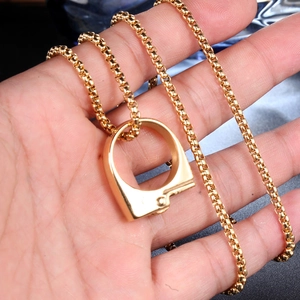 Polished gold box chain necklace with a minimalist single handcuff pendant for men