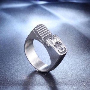Detailed macro shot of vintage industrial steel ring with embossed mechanical gears texture