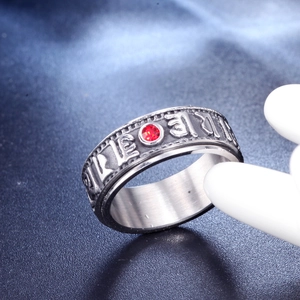 Silver stainless steel spinner ring with Buddhist mantra engraving and red gemstone inlay