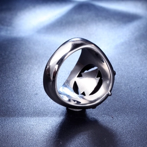 Macro shot of silver stainless steel ring with hollowed Viking geometric patterns