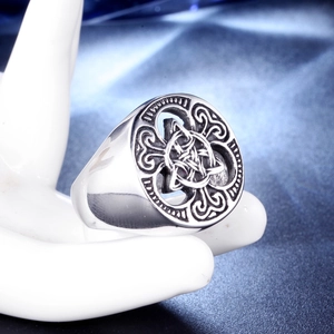 Retro Viking stainless steel signet ring with Celtic knot motif on blue satin
