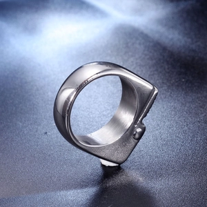 Detail of wide industrial style stainless steel ring with inner brushed texture finish