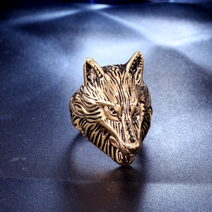 Detailed view of vintage gold wolf head ring with realistic texture and antique finish
