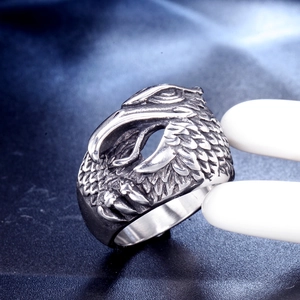 Retro stainless steel eagle head ring for men with detailed feather texture in punk style