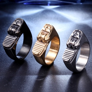 Industrial style stainless steel rings in black, gold, and silver with mechanical gear design