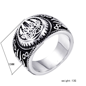 Macro detail of retro stainless steel ring with Celtic knot relief, 15mm width