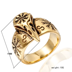Detailed view of vintage gold eagle skull ring with Viking Vegvisir compass engraving