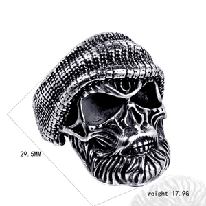 Detailed macro view of a skull ring with knit hat, showing 29.5mm height and 17.9g weight