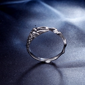 Gothic style stainless steel ring with dragon scale texture and organic twisted design
