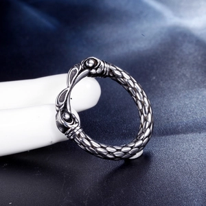 Macro shot of stainless steel chain ring featuring vintage textured pattern and gothic relief