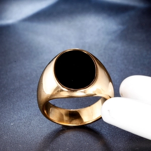 Men's gold-plated stainless steel signet ring with a large round black gemstone inlay