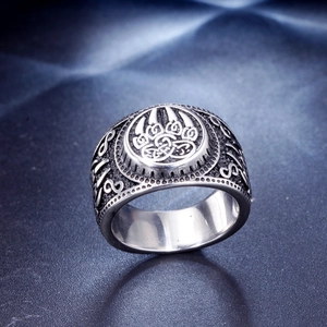 Macro view of a bear paw relief ring with Celtic knot patterns in vintage silver finish