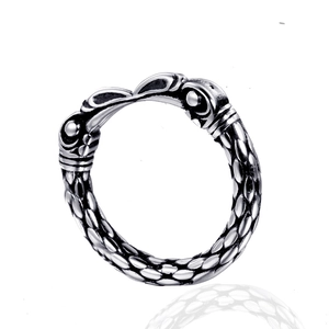 Vintage stainless steel chain ring with scale texture and embossed details on white background