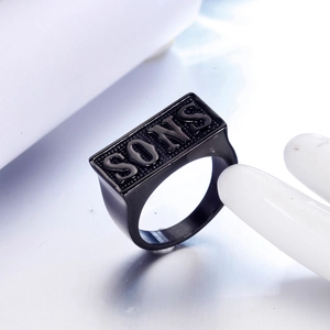Men's black stainless steel signet ring with embossed SONS letters on rectangular face