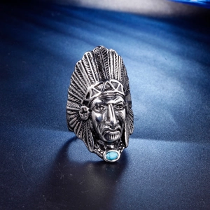 Detail of vintage native american chief ring with intricate feathers and blue turquoise