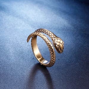 Vintage golden stainless steel snake ring with textured scales and open wrap design