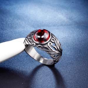 Vintage stainless steel men's ring with oval red gemstone and carved floral details