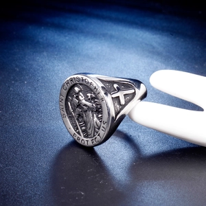 Retro Saint Christopher stainless steel ring with side cross relief on a jewelry hand