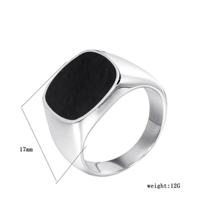 Detail showing 17mm wide flat top square signet ring weighing 12g with black inlay