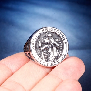 Detailed macro view of the Saint Christopher religious relief engraving on a vintage ring