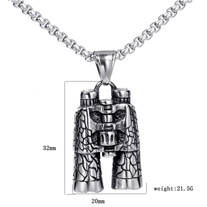 Detailed close-up of retro telescope pendant necklace with measurement specs and stone texture