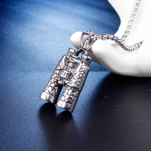 Vintage binoculars pendant necklace in textured titanium steel on a display stand
