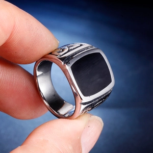 Retro stainless steel signet ring for men featuring a square black enamel top and relief