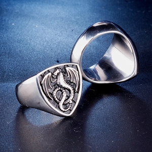Vintage stainless steel signet ring for men featuring detailed dragon relief on shield