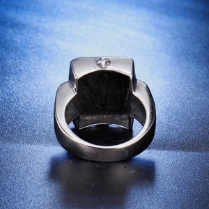 Men's silver cross signet ring in polished stainless steel with embossed side patterns