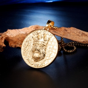 Gold gorilla pendant necklace with crown and cracked texture on box chain for hip hop style
