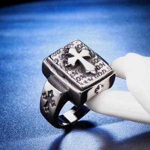 Macro view of vintage cross ring with religious engravings and embossed bible design