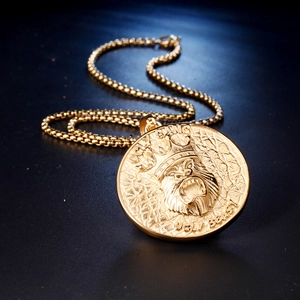 Gold round pendant necklace with a roaring beast crown and bead chain in punk style