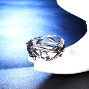 Retro silver thorn branch crown ring in vintage style on white display stand