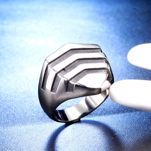 Men's wide stainless steel ring with a geometric V-shaped tiered design in gunmetal silver