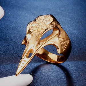 Golden Viking crow skull ring with Vegvisir and Valknut runes in gothic punk style