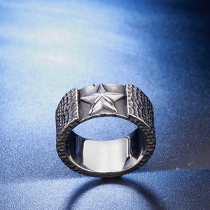 Retro punk titanium steel men's wide ring featuring a 3D star relief on blue background