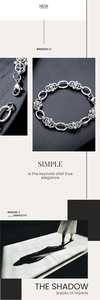 Detailed view of silver chain bracelet with alternating smooth and textured woven links