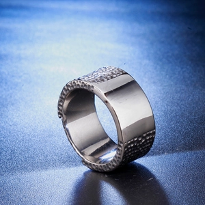 Vintage industrial style men's wide stainless steel ring with hammered edge and mirror finish