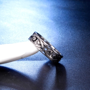 Macro shot of Celtic scrollwork hollow design on vintage stainless steel ring