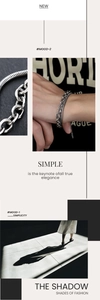 Detail of double-layer snake and cuban chain silver bracelet with modern minimalist design