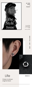 Detail shot of Mobius magnetic ear clip showing silver spiral texture and black stone inlay