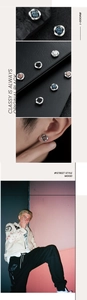 Macro shot of Mobius magnetic clip earrings in blue, black, white and pink colors