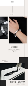 Detail of white turquoise and black onyx beaded bracelet with vintage silver alloy spacers