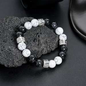 White turquoise and black onyx beaded bracelet with silver geometric metal charms