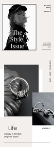 Detail view of silver steel hoop earrings with black cross pattern decorative beads