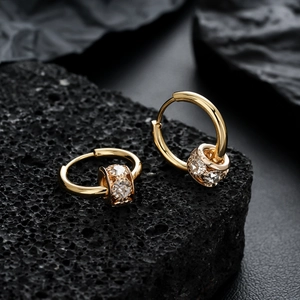 Luxurious gold-plated huggie hoop earrings with sparkling cubic zirconia barrel charm