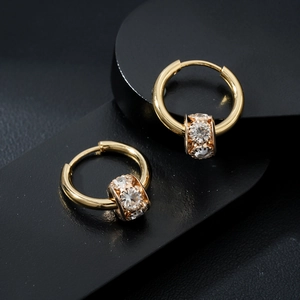 Polished gold waist hoop earrings with sparkling cubic zirconia on black geometric base