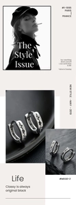 Macro view of silver titanium steel hoop earrings featuring engraved heartbeat pattern detail