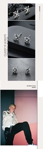 Détails macro des boucles d'oreilles étoile gothique en argent au style urbain chic