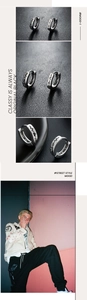 Macro detail of silver stainless steel hoop earrings with heartbeat cutout pattern